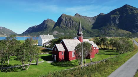 Old-church-in-Flakstad,-Lofoten-Islands,-Norway,-Scandinavia---Aerial-Circling