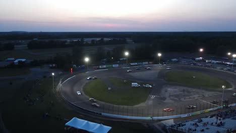Night-time-racing-in-Flat-Rock-Speedway,-Flat-Rock,-Michigan,-USA,-aerial-view