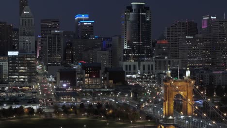 Aerial-of-Modern-US-city-Cincinnati-at-night,-establish-shot
