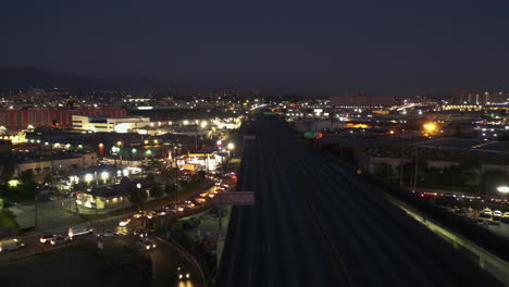 Aerial-view-of-the-closed-I-10-and-the-illuminated-cityscape-of-Los-Angeles