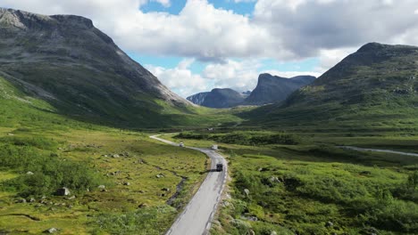 Camper-Van-RV-drives-scenic-route-to-Trollstigen-in-Reinheimen-National-Park,-Norway---Aerial