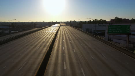 Aerial-view-over-a-person-walking-on-the-closed-Interstate-10,-in-Los-Angeles,-USA