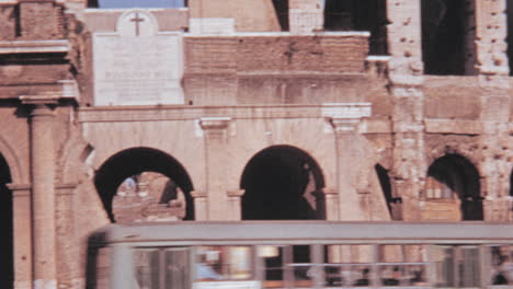 Low-Angle-View-of-People-Walking-on-Rome-Colosseum-Balcony-in-1960s