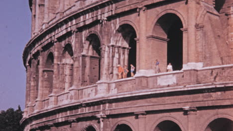 People-Enjoy-Panorama-from-the-Large-Windows-of-the-Colosseum-of-Rome-in-1960s