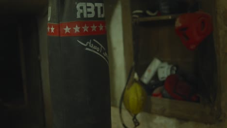 Closeup-of-punches-being-delivered-on-punching-bag-in-gym-during-boxing
