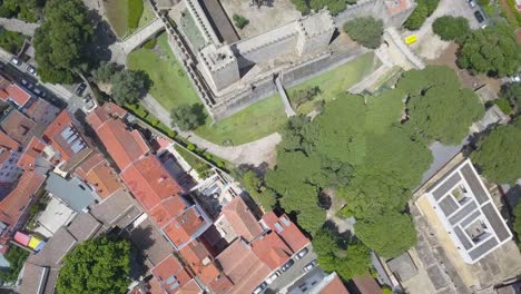 Top-down-trucking-pan-along-Sao-Jorge-castle-walls-in-Lisbon-Portugal