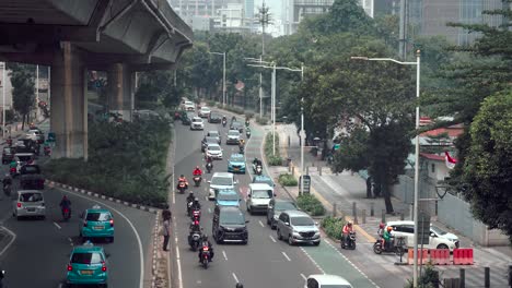Busy-traffic-on-streets-of-Jakarta-on-Independence-Day,-Moving-traffic-on-road,-Indonesia