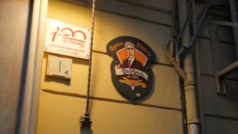 Detail-of-symbol-at-the-entrance-to-Famous-Pizzeria-Da-Michele-Chain,-considered-as-the-first-pizzeria's-in-the-world
