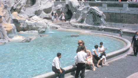 People-Enjoy-a-Summers-Day-at-Fontana-di-Trevi-in-Rome-in-the-1960s