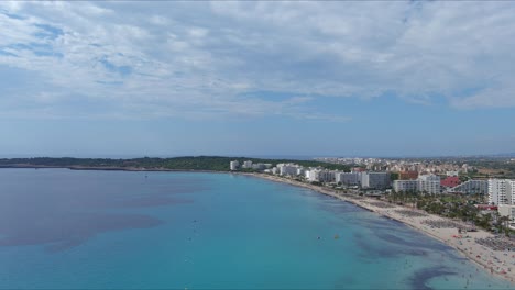 Mallorca:-Aerial-View-Of-Resort-Town-Son-Servera-On-Majorca-Island,-Spain,-Europe-|-Slow-Down-Over-Beach