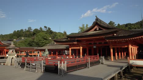 View-Of-The-Takabutai-And-Haraiden-At-Itsukushima-Shrine-With-Blue-Skies-Overhead
