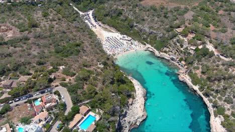Mallorca:-Aerial-View-Of-Resort-Town-Cala-Liombards-On-Majorca-Island,-Spain,-Europe-|-City-Coast-to-Crowded-Beach