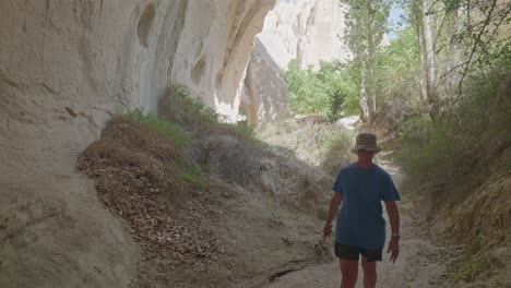 Female-hiker-explores-Rose-valley-trail-Cappadoccia-landscape