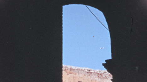 Airplane-Flies-over-the-Colosseum-of-Rome-in-1960s
