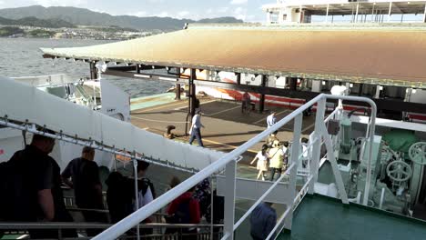 Passengers-And-Tourists-Disembarking-Off-The-JR-Miyajima-Ferry-Boat-At-Miyajima-Matsudai-kisen-Ferry-Terminal