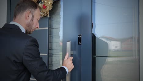 Business-man-using-fingerprint-to-unlock-smart-key-home-entrance,-future-concept