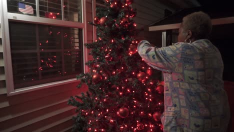Black-woman-decorating-Christmas-tree