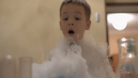 Boy-having-fun-with-liquid-nitrogen-white-smoke