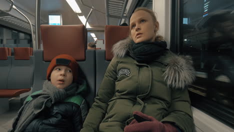 Mother-and-child-having-a-ride-in-suburban-train