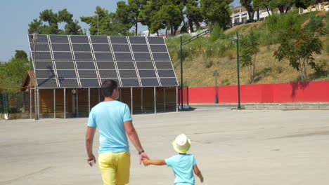 Father-showing-son-solar-panels