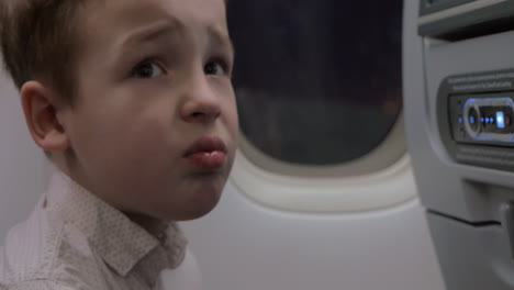 Child-in-plane-refusing-to-take-medicine