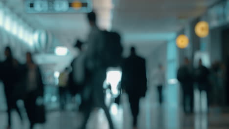 Airport-hall-with-walking-people-defocus