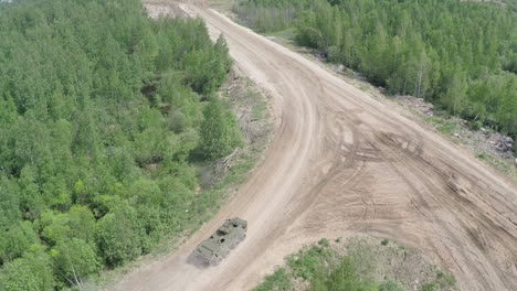 Armoured-vehicle-on-country-road-aerial-view