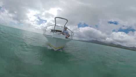 Man-enjoying-water-travel-by-yacht-in-the-ocean-near-Mauritius