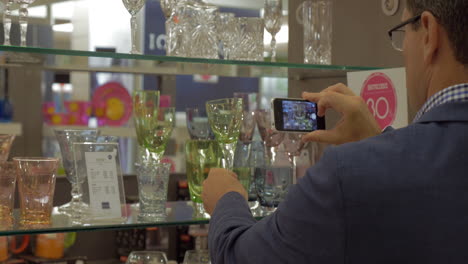 Man-taking-a-shot-of-glass-in-the-store