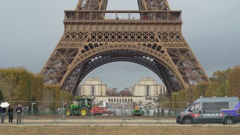 Tractor-Prepares-Champ-de-Mars-near-Eiffel-Tower-for-Upcoming-Winter-on-a-Gloomy-Day-in-Paris