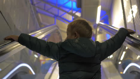 Child-getting-upstairs-on-escalator