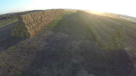 Aerial-view-of-stacked-hay-rolls-in-the-filed