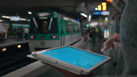 Girl-typing-message-on-digital-tablet-in-underground