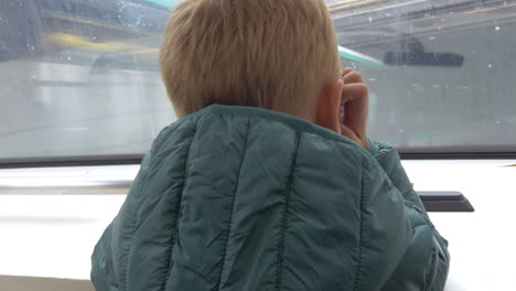 Child-traveling-in-subway-train