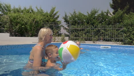 United-Family-Playing-Ball-in-the-Pool