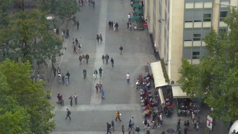People-walking-on-city-street-high-angle