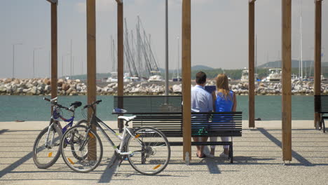 Couple-with-digital-tablet-on-waterfront