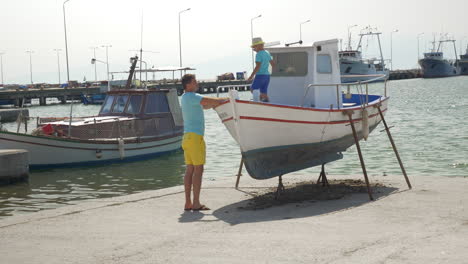 Father-and-son-on-the-docks-with-boats