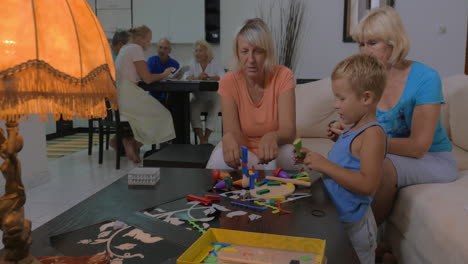 Grandmothers-playing-with-grandson-at-home
