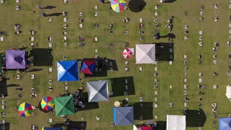 Aerial-top-down-perspective-above-a-cemetery-with-families-visiting-grave-sites