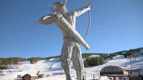 Ullr,-the-Norse-God-of-snow,-at-the-base-of-Peak-8-at-Breckenridge-Ski-Resort,-tilt