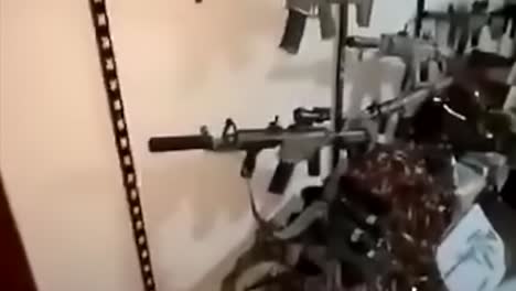Israeli-IDF-army-inside-Humas-terrorist-tunnel-in-Gaza-showing-seized-guns-and-weapons,-raw-footage