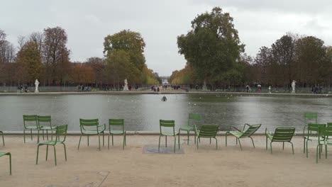 Fountain-with-People-Walking-in-Place-du-Carrousel-garden-near-Louvre-Palace