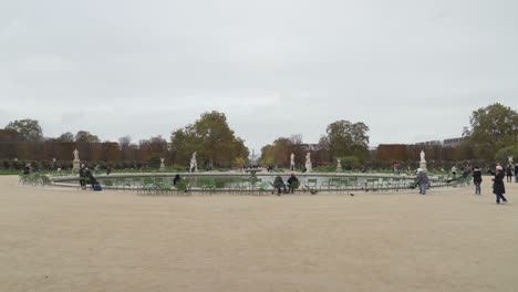 Fountain-in-Place-du-Carrousel-garden-with-Arc-de-Triomphe-in-Distance