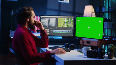 Video-editor-analyzing-film-montage-on-green-screen-monitor-before-editing-color-grading
