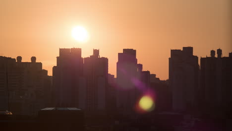 Time-lapse-shot-of-sun-rising-and-moving-in-the-sky-city-modern-buildings-on-the-foreground-Seoul-South-Korea