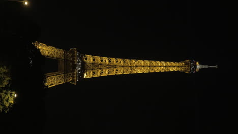 Vertical-video-of-Eiffel-Tower-illuminated-at-night
