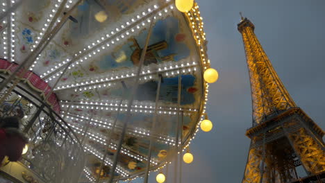 Illuminated-Eiffel-Tower-and-vintage-carousel