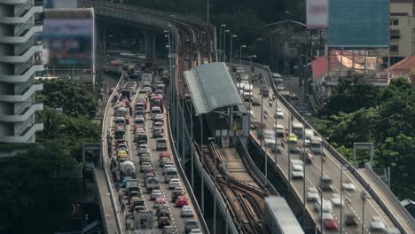 Time-lapse-shot-of-multi-level-traffic-road-railway-and-train-station-Bangkok-Thailand