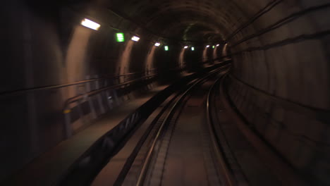 Train-moving-through-the-subway-tunnel-cabin-view